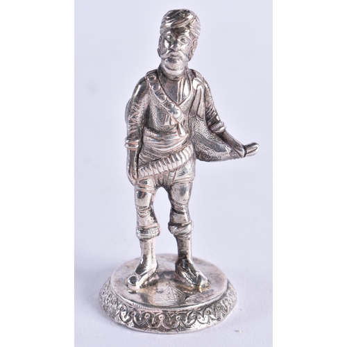 102 - A RARE 19TH CENTURY CAST SILVER FIGURE OF AN INDIAN MAHARAJA bearing Bishops Mitre crest to base. 65... 
