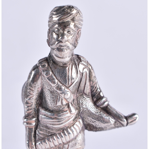 102 - A RARE 19TH CENTURY CAST SILVER FIGURE OF AN INDIAN MAHARAJA bearing Bishops Mitre crest to base. 65... 