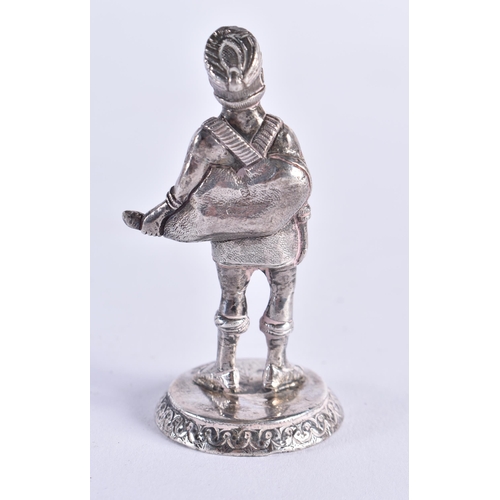 102 - A RARE 19TH CENTURY CAST SILVER FIGURE OF AN INDIAN MAHARAJA bearing Bishops Mitre crest to base. 65... 