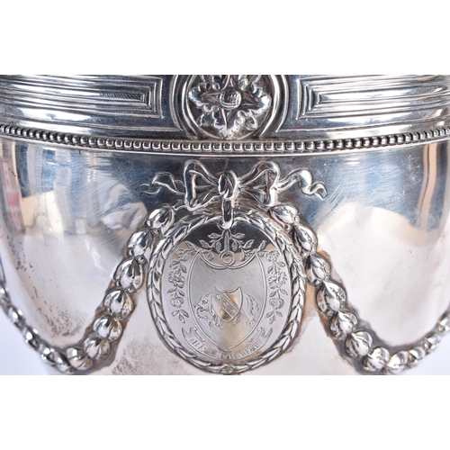 106 - A GOOD GEORGE III SILVER ADAM-STYLE TEA URN with leaf cast finial and coat of arms to the lift of li... 