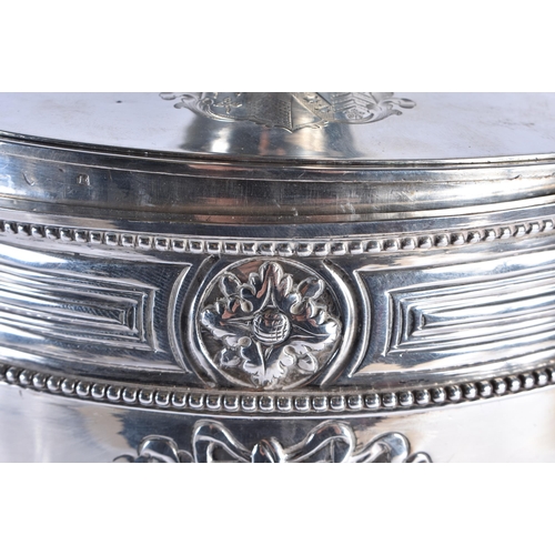 106 - A GOOD GEORGE III SILVER ADAM-STYLE TEA URN with leaf cast finial and coat of arms to the lift of li... 