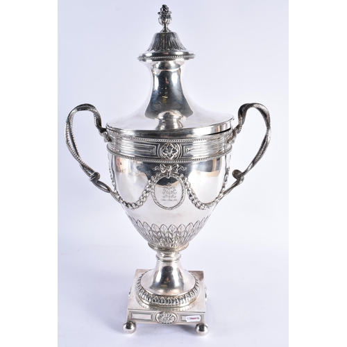 106 - A GOOD GEORGE III SILVER ADAM-STYLE TEA URN with leaf cast finial and coat of arms to the lift of li... 