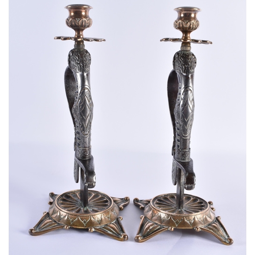 109 - A LOVELY PAIR OF 19TH CENTURY ENGLISH COUNTRY HOUSE MILITARY INTEREST CANDLESTICKS formed as steel l... 