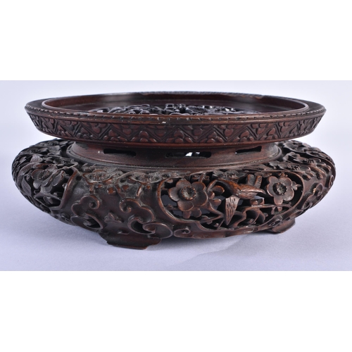 112 - A FINE EARLY 19TH CENTURY CHINESE CARVED HARDWOOD DRAGON STAND Qing, beautifully carved with a friez... 