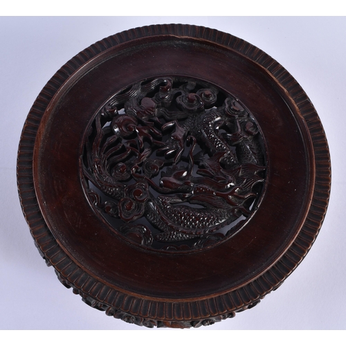 112 - A FINE EARLY 19TH CENTURY CHINESE CARVED HARDWOOD DRAGON STAND Qing, beautifully carved with a friez... 