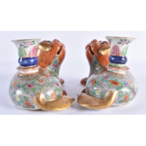 114 - A PAIR OF EARLY 19TH CENTURY CHINESE CANTON FAMILLE ROSE JOSS STICK HOLDERS Qing, modelled as coral ... 