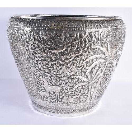 125 - A VERY LARGE LATE 19TH CENTURY INDIAN WHITE METAL JARDINIERE decorative with animals and palm trees,... 