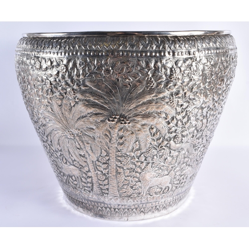 125 - A VERY LARGE LATE 19TH CENTURY INDIAN WHITE METAL JARDINIERE decorative with animals and palm trees,... 
