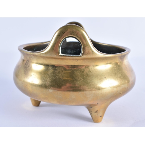 127 - AN 18TH CENTURY CHINESE TWIN HANDLED BRONZE CENSER with high loop handles, bearing Xuande marks to b... 