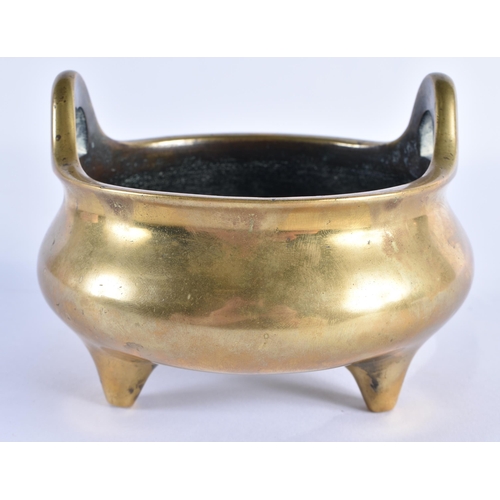 127 - AN 18TH CENTURY CHINESE TWIN HANDLED BRONZE CENSER with high loop handles, bearing Xuande marks to b... 
