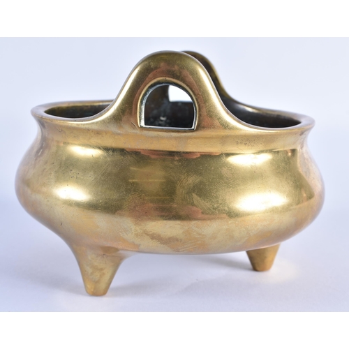 127 - AN 18TH CENTURY CHINESE TWIN HANDLED BRONZE CENSER with high loop handles, bearing Xuande marks to b... 