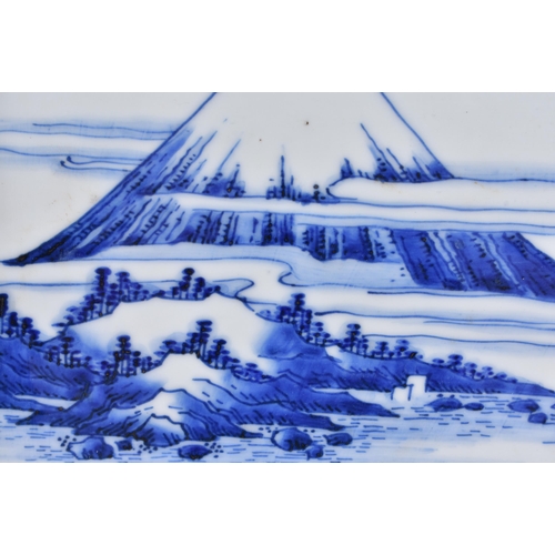 132 - A 19TH CENTURY JAPANESE MEIJI PERIOD BLUE AND WHITE PORCELAIN TRAY painted with landscapes and Mt Fu... 