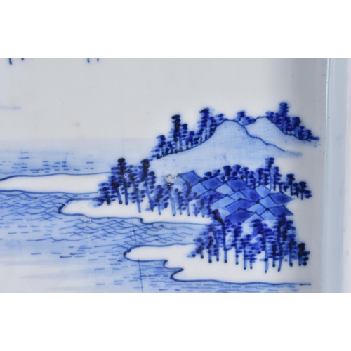 132 - A 19TH CENTURY JAPANESE MEIJI PERIOD BLUE AND WHITE PORCELAIN TRAY painted with landscapes and Mt Fu... 