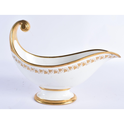 157 - A LATE 19TH CENTURY FRENCH SEVRES PORCELAIN SAUCE BOAT painted with gilded flowers and trailing vine... 
