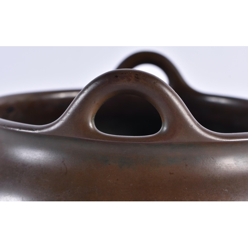 167 - A RARE CHINESE QING DYNASTY TWIN HANDLED BRONZE CENSER bearing unusual studio mark to base. 2378 gra... 