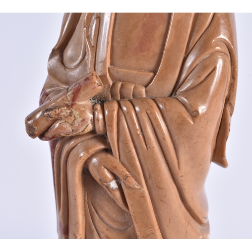 179 - A LATE 18TH/19TH CENTURY CHINESE CARVED SOAPSTONE FIGURE OF AN IMMORTAL Late Qianlong/Jiaqing. 23.5 ... 