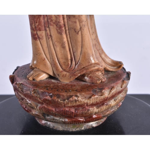 179 - A LATE 18TH/19TH CENTURY CHINESE CARVED SOAPSTONE FIGURE OF AN IMMORTAL Late Qianlong/Jiaqing. 23.5 ... 