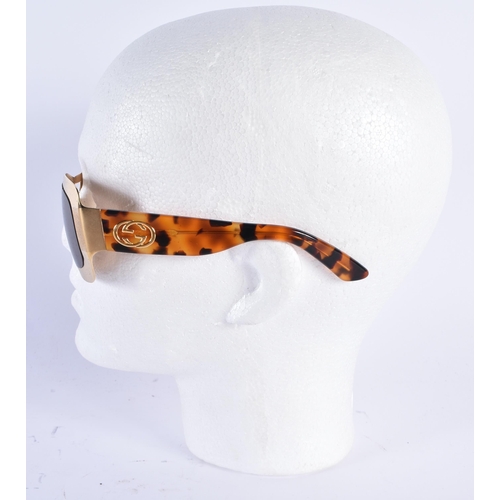 62 - A CASED PAIR OF GUCCI SUNGLASSES. 15 cm wide.
