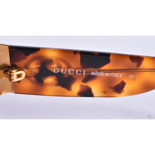62 - A CASED PAIR OF GUCCI SUNGLASSES. 15 cm wide.