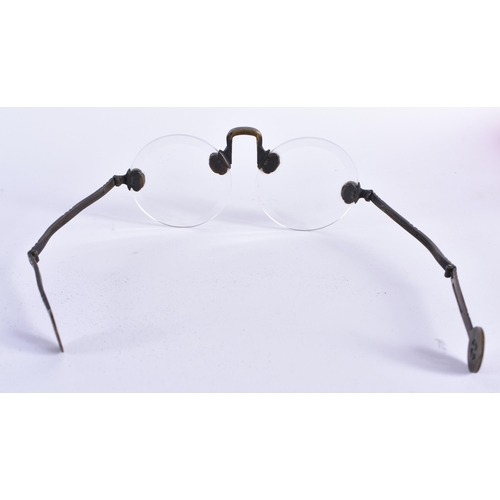 65 - A RARE PAIR OF CHINESE QING DYNASTY BRONZE SPECTACLES. 15 cm wide.