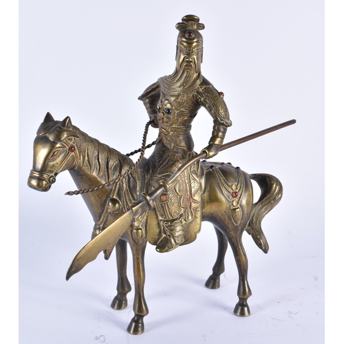 69 - A CHINESE QING DYNASTY BRONZE FIGURE OF A WARRIOR ON HORSEBACK inset with gems, embellished in motif... 