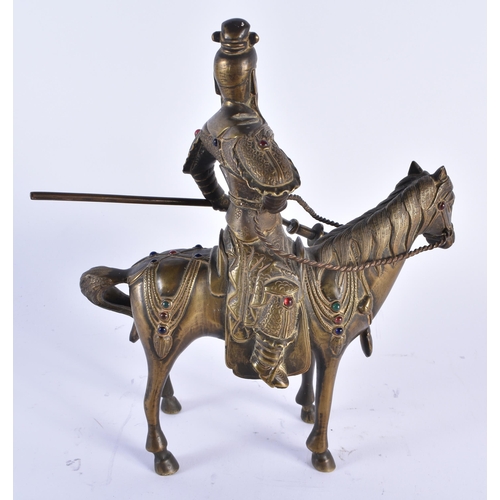 69 - A CHINESE QING DYNASTY BRONZE FIGURE OF A WARRIOR ON HORSEBACK inset with gems, embellished in motif... 