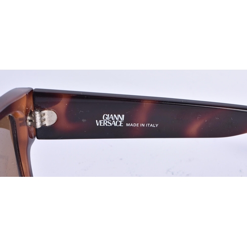 73 - A PAIR OF VERSACE SUNGLASSES. 15 cm wide.