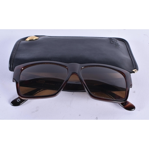 74 - A PAIR OF GUCCI SUNGLASSES. 15 cm wide.