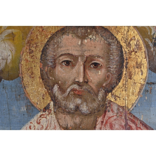 77 - AN ANTIQUE RUSSIAN PAINTED WOOD ICON together with a framed Italian picture. Largest 30 cm x 22 cm. ... 