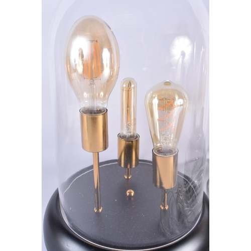 82 - A PAIR OF CONTEMPORARY TRIPLE BULB GLASS LAMPS. 45 cm x 20 cm.