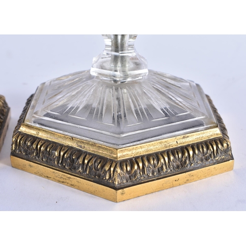 84 - A FINE PAIR OF EARLY 19TH CENTURY CONTINENTAL BRONZE AND ROCK CRYSTAL CANDLESTICKS French of Russian... 