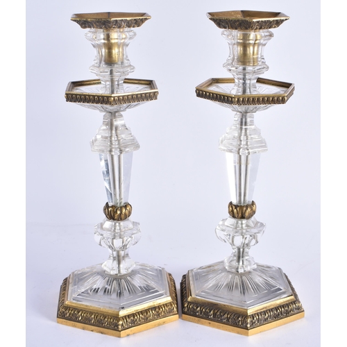 84 - A FINE PAIR OF EARLY 19TH CENTURY CONTINENTAL BRONZE AND ROCK CRYSTAL CANDLESTICKS French of Russian... 