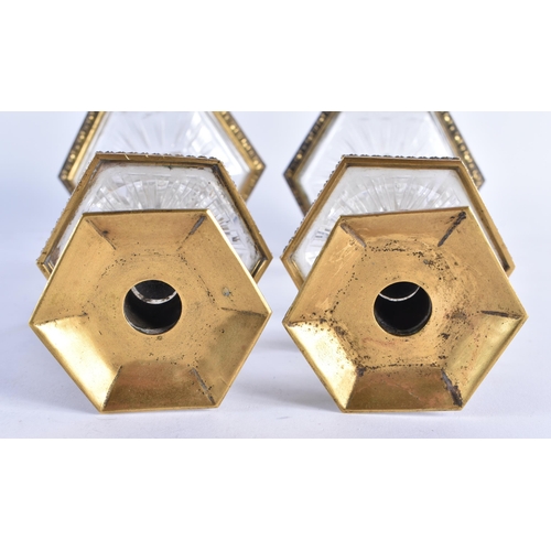 84 - A FINE PAIR OF EARLY 19TH CENTURY CONTINENTAL BRONZE AND ROCK CRYSTAL CANDLESTICKS French of Russian... 