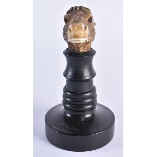 85 - A VERY RARE 19TH CENTURY EUROPEAN CARVED ARTICULATED DONKEY HEAD formed upon an ebonised base, natur... 