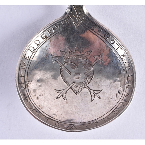 90 - A RARE 17TH CENTURY GERMAN SILVER SPOON with wyvern twisted handle, the bowl engraved with a motto a... 