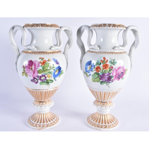 96 - A LARGE PAIR OF EARLY 20TH CENTURY GERMAN TWIN HANDLED MEISSEN PORCELAIN VASES painted with floral s... 