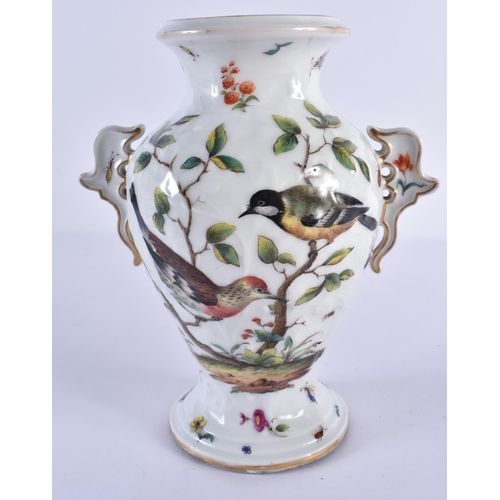 106 - AN AUSTRIAN TWIN HANDLED RELIEF MOULDED PORCELAIN VASE painted with birds amongst foliage and vines.... 