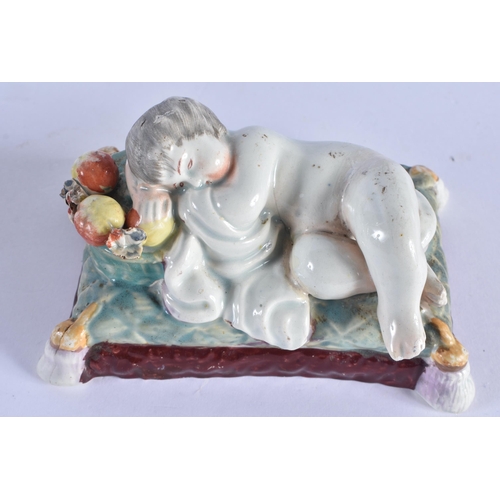 114 - AN EARLY 19TH CENTURY ENGLISH PEARLWARE FIGURE OF A RECLINING CHILD together with an early salt glaz... 