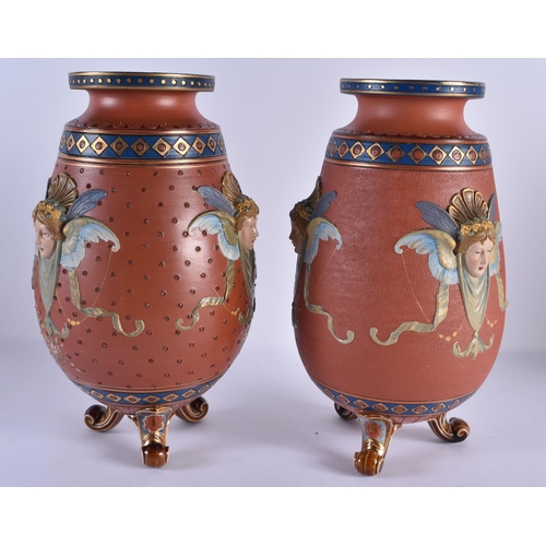 116 - A RARE PAIR OF 19TH CENTURY METTLACH POTTERY VASES decorated in relief with classical mask heads, un... 