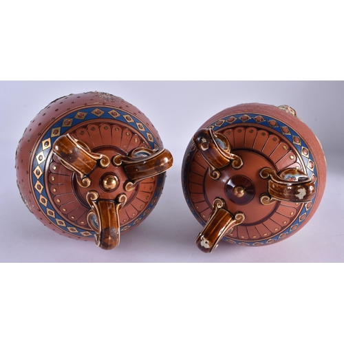 116 - A RARE PAIR OF 19TH CENTURY METTLACH POTTERY VASES decorated in relief with classical mask heads, un... 