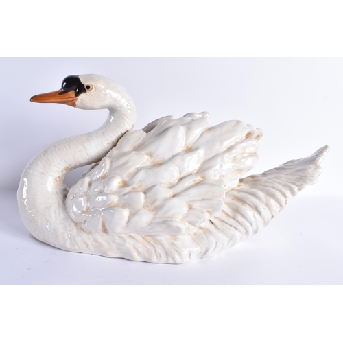 126 - A LARGE PAIR OF 19TH CENTURY CONTINENTAL COUNTRY HOUSE CERAMIC FIGURES OF SWANS modelled with natura... 