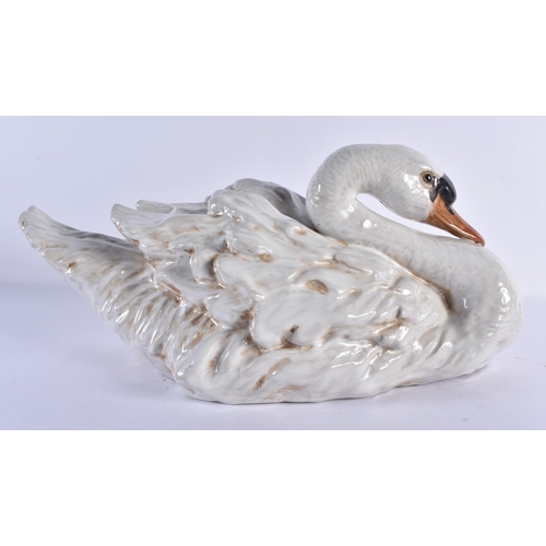 126 - A LARGE PAIR OF 19TH CENTURY CONTINENTAL COUNTRY HOUSE CERAMIC FIGURES OF SWANS modelled with natura... 