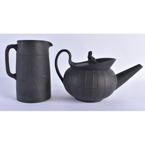 127 - A WEDGWOOD BLACK BASALT TEAPOT AND COVER together with a Wedgwood jug & two black basalt cream jugs.... 