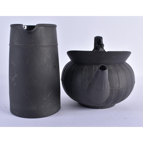 127 - A WEDGWOOD BLACK BASALT TEAPOT AND COVER together with a Wedgwood jug & two black basalt cream jugs.... 