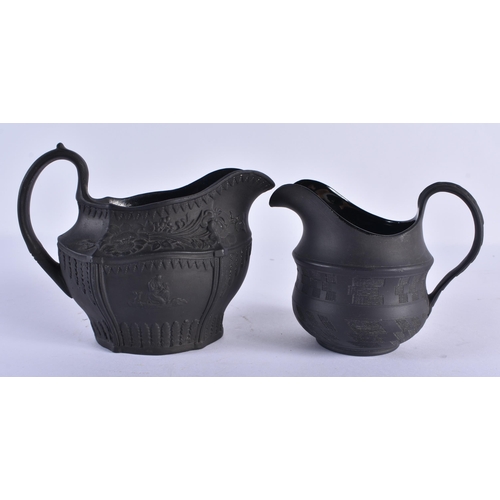 127 - A WEDGWOOD BLACK BASALT TEAPOT AND COVER together with a Wedgwood jug & two black basalt cream jugs.... 