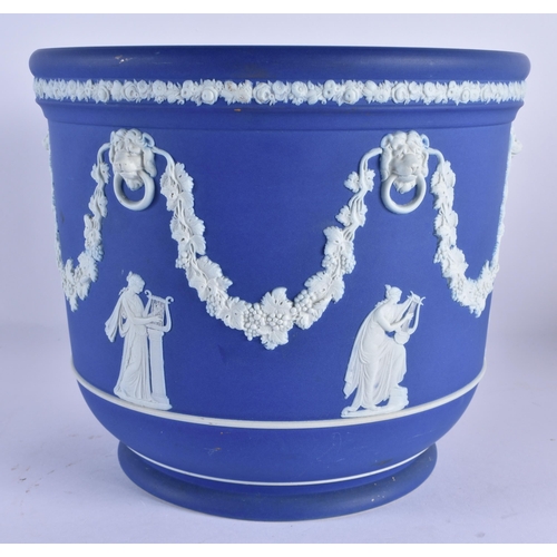 130 - A VERY LARGE WEDGWOOD BLUE BASALT JARDINERE decorated with classical figures, lions and trailing swa... 