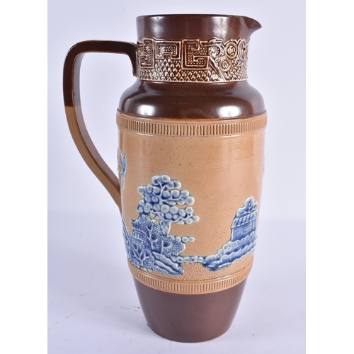 133 - AN UNUSUAL DOULTON STONE GLAZED BLUE AND WHITE RELIEF LANDSCAPE JUG. 25cm high.