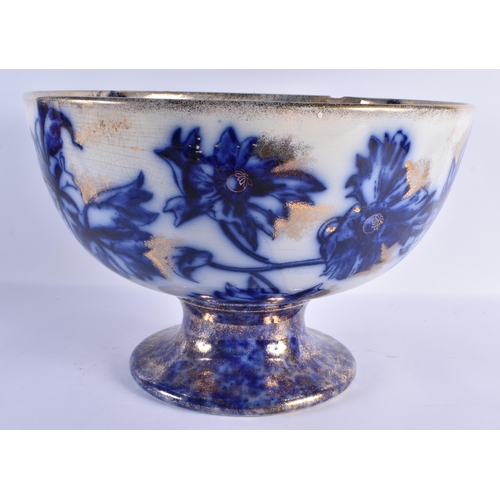 134 - A RARE LARGE ANTIQUE FLOW BLUE PEDESTAL FRUIT BOWL highlighted unusually in powder gilt. 36 cm x 26 ... 