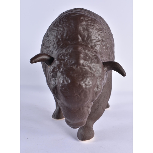 151 - A RETRO BROWN PAINTED GERMAN CERAMIC FIGURE OF A BISON. 35 cm x 22cm.