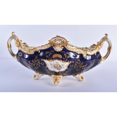 174 - Late 19th century Coalport boat shaped two handled vase and cover painted with bird on a cobalt blue... 